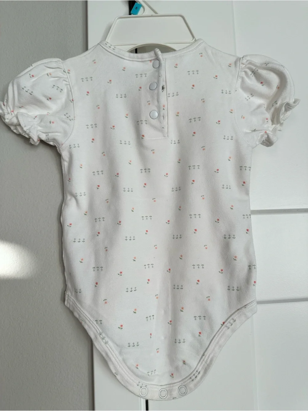Cherokee baby play-wear. White Baby Onesie with Tiny Pink & Green Floral Print